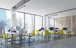 Empty city view office with yellow chairs