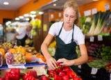 Teenager working in a grocery shop