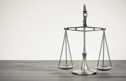 silver balancing scales on a desk