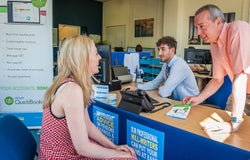 TaxAssist franchisee Nigel Lomax serves customer at his TaxAssist office on Sundorne Avenue, Shrewsbury