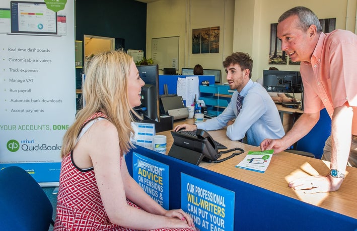 TaxAssist franchisee Nigel Lomax serves customer at his TaxAssist office on Sundorne Avenue, Shrewsbury