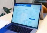 A laptop displaying a checkout page