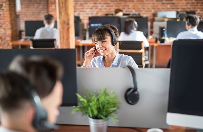 Call center worker accompanied by her team.