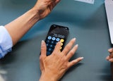 A person types on a calculator app