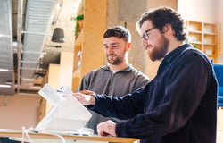 The Senior Research Executive and Reviews Writer testing a POS terminal