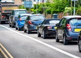 heavy traffic jam next to bus lane in england uk