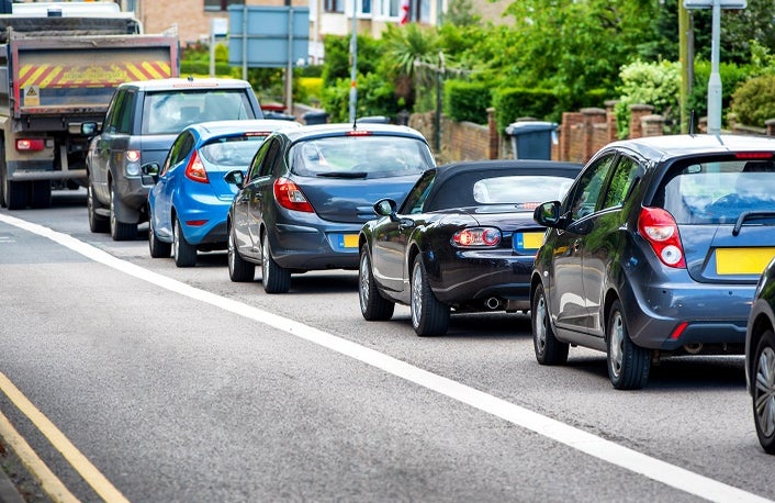 heavy traffic jam next to bus lane in england uk