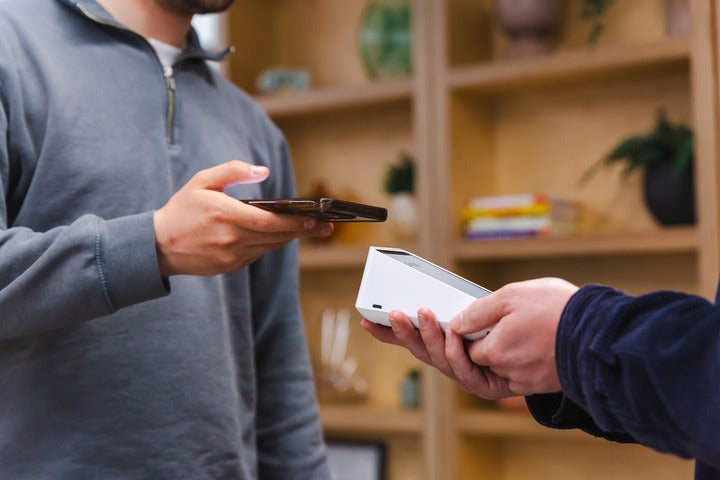 The Square Terminal being used to take a payment in the Startups offices