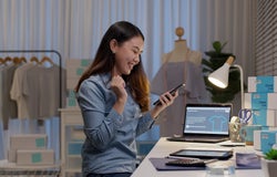 Woman-celebrates-taking-out-a-business-loan