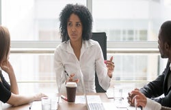 LEEP woman boss hosting a meeting
