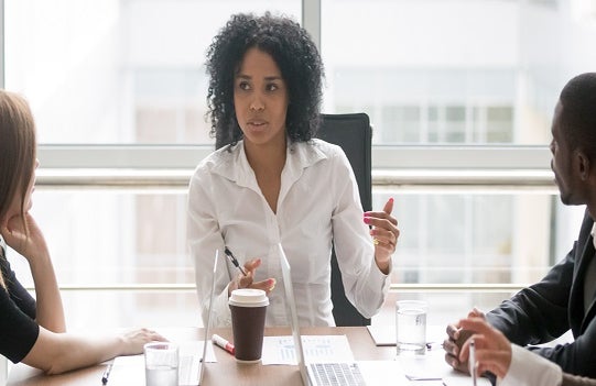 LEEP woman boss hosting a meeting