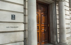 Image of the front door to the HM Treasury building on Horse Guard Road, Whitehall with the words 'HM Treasury' painted onto the wall.
