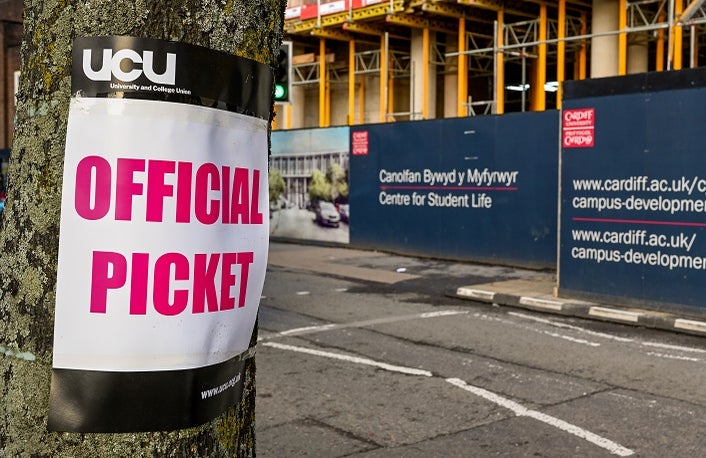 Cardiff, Wales - November Sign attached to a tree near an official picket line outside Cardiff University. as part of industrial action by members of the Universities and College Union.