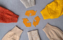 Clothing recycling. Used clothes in a circle. Ecological and sustainable fashion