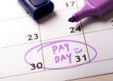 payday concept calendar with marker and circled day of salary