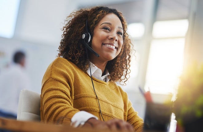 woman, call center agent or smile with voip for consulting, listening or contact us in office. Female consultant, customer service or tech support crm with headphones, microphone or help desk