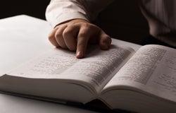 man is looking for information in the directory close-up