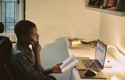 a man learning online via his laptop