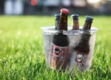 selection of beers in an ice bucket in a park