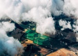 aerial view of a field with wind turbines in it