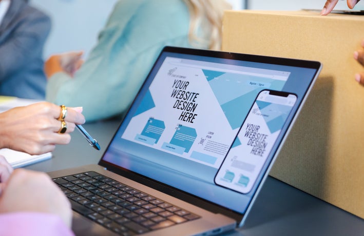 Side shot of laptop with website builder