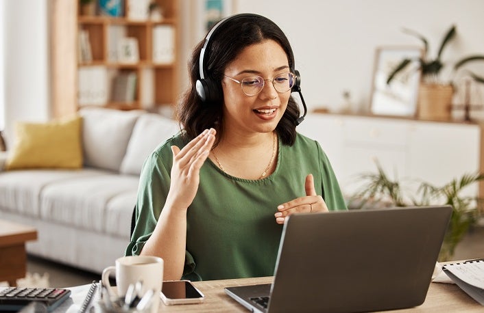 Home customer support, laptop video call and woman explain consultation, ecommerce or sales pitch in webinar. Freelance, remote work receptionist or person consulting on online conference discussion.
