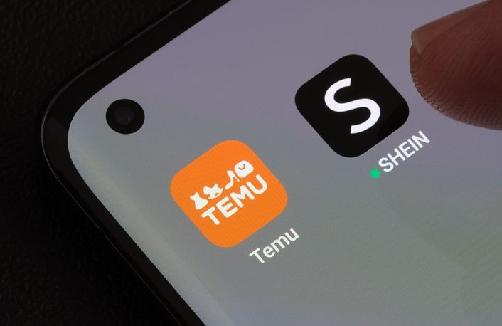 TEMU and SHEIN apps seen on the screen of smartphone. Temu app and Shein app are chinese budget shopping platforms. Stafford, United Kindom, May 2, 2023
