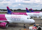 LUTON, UK - JULY 12, 2019: Wizz Air Airbus A320 fleet at London Luton Airport in the UK. It is UK's 5th busiest airport with 16.5 million annual passengers.