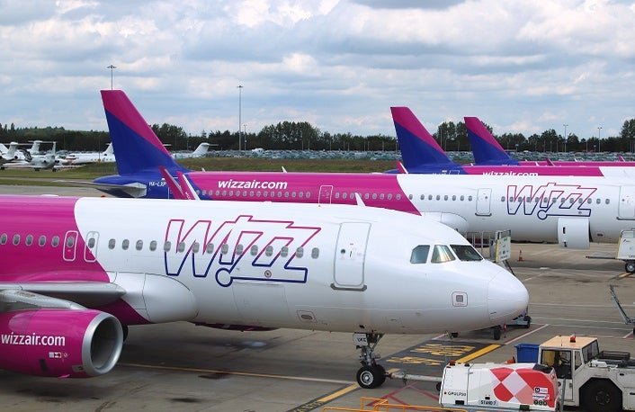 LUTON, UK - JULY 12, 2019: Wizz Air Airbus A320 fleet at London Luton Airport in the UK. It is UK's 5th busiest airport with 16.5 million annual passengers.