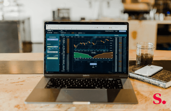 an image of a laptop showing graphs and charts