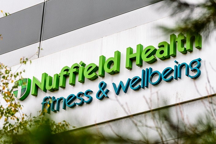 NORTHAMPTON, UK - 29 OCTOBER 2017: Nuffield Health Fitness Wellbeing logo in Sixfields Retail park