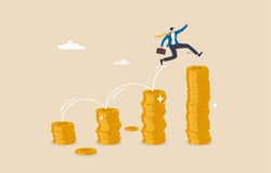 Man jumping from pile of gold coins to higher pile of gold coins