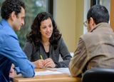 Three colleagues having a meeting