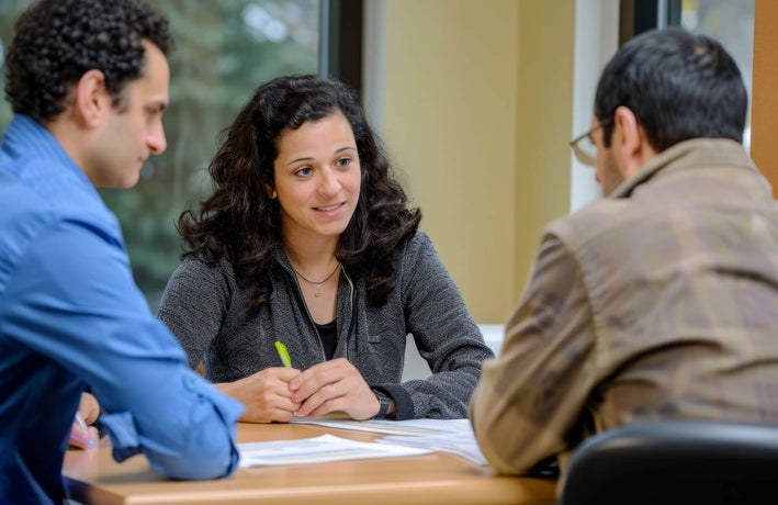 Three colleagues having a meeting