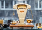 Old fashioned scales in front of a window