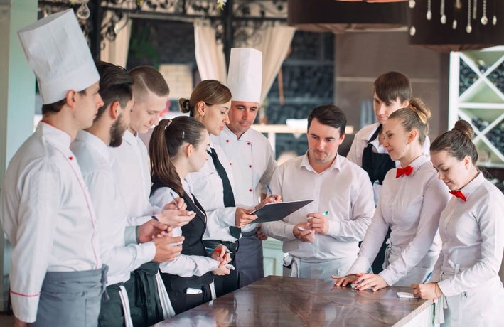 Team of restaurant staff having a meeting