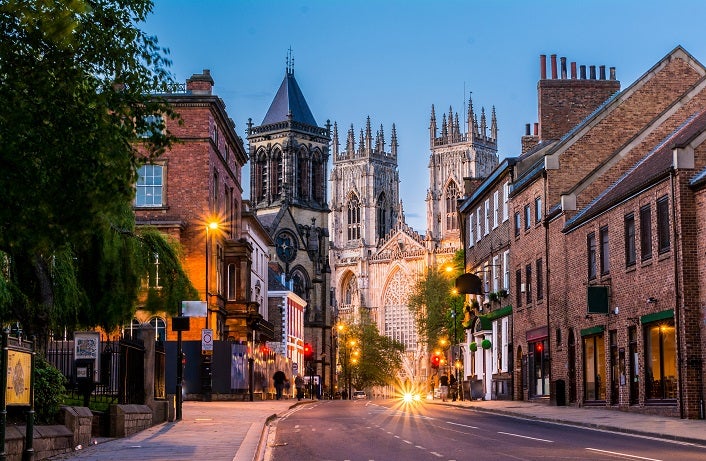 York evening cityscape view from the street with York Minster in the background.