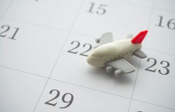 Model aeroplane placed on a calendar