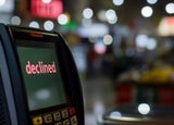 A payment terminal screen displaying the word 