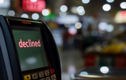 A payment terminal screen displaying the word 