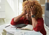 Business debt stressed out looking business owner frets over bills