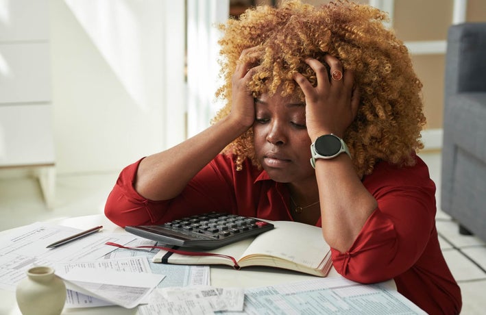 Business debt stressed out looking business owner frets over bills