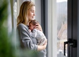 Woman holding a newborn baby