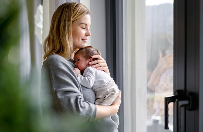 Woman holding a newborn baby