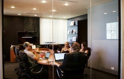 Managers conducting an interview in a meeting room