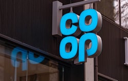 Sign of the co-op hanging outside a high street store.