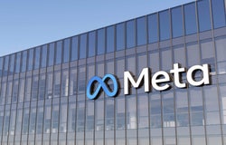 A close up shot of a Meta office block with its logo prominently displayed.