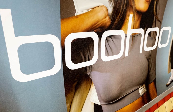 Close up of a Boohoo ad displayed within the London underground.