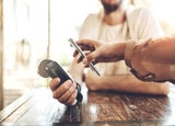 POS and phone at a cafe for payment.