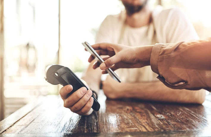 POS and phone at a cafe for payment.